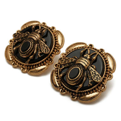 Paire de boucles d'oreilles Abeille Dorée en agate noire et métal doré, style vintage.