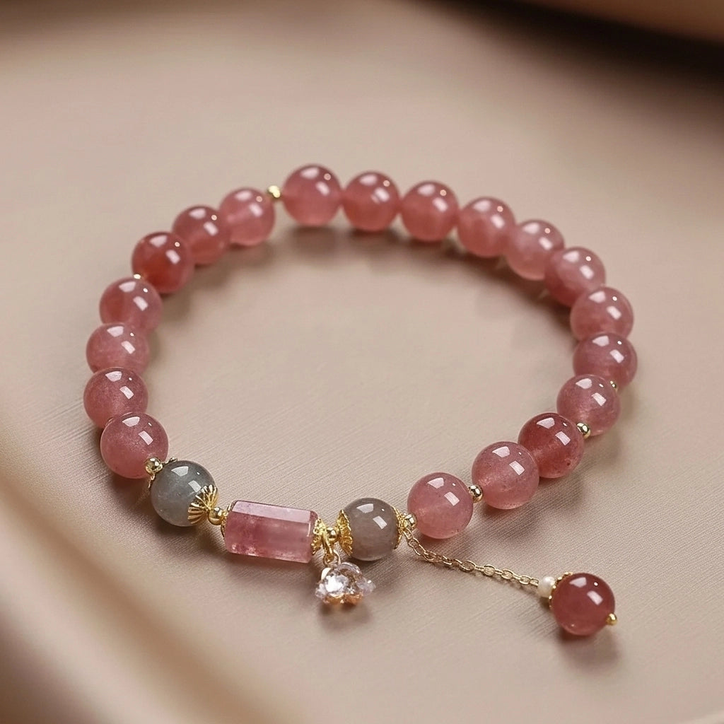 Bracelet en quartz rose avec breloque en forme d'étoile et perles grises